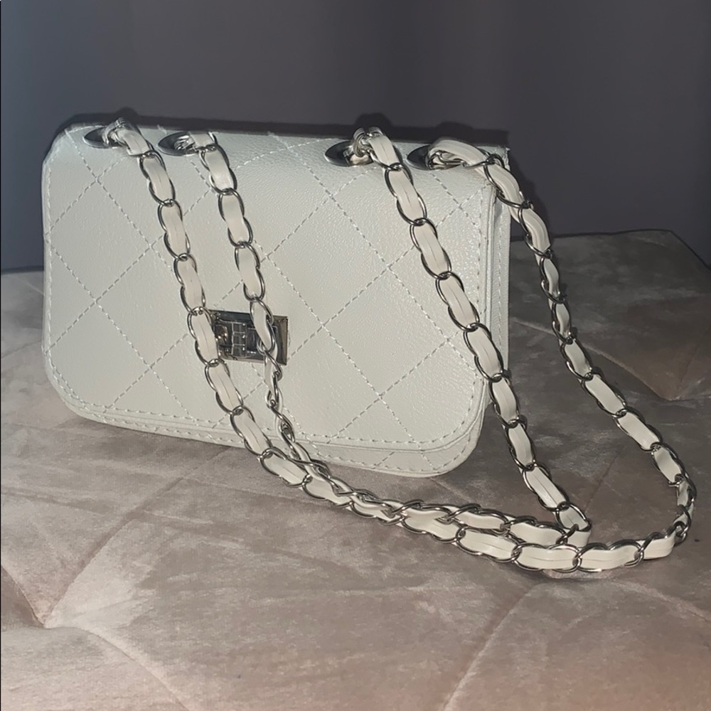 Cream colored, quilt pattern. Multi wear purse/bag